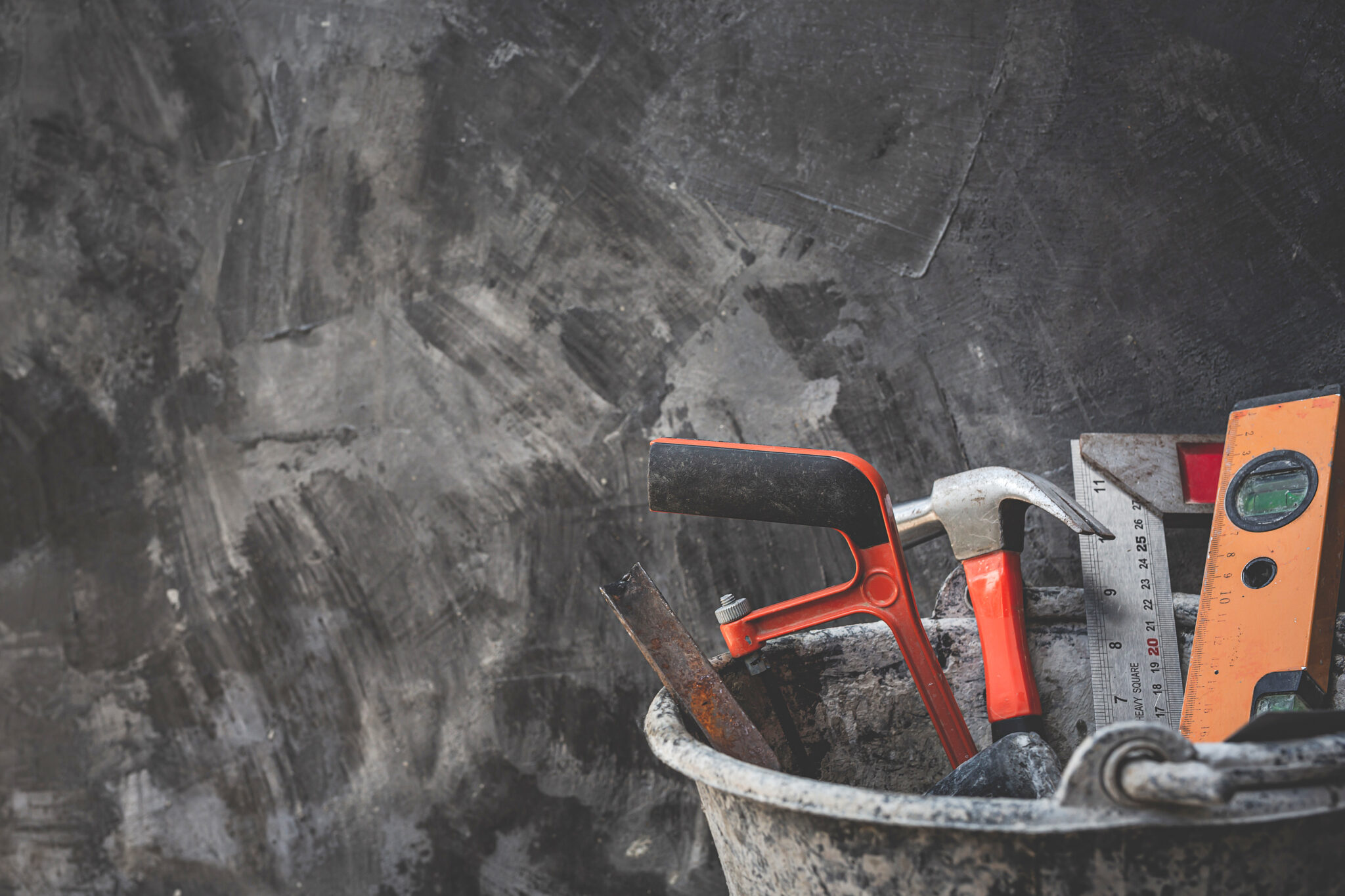 Construction tools placed on wooden floors.